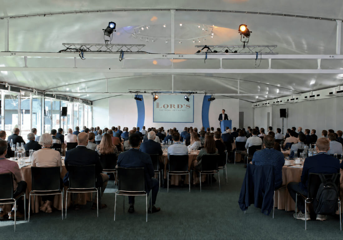 A conference setting at Lord’s with guests seated facing a stage